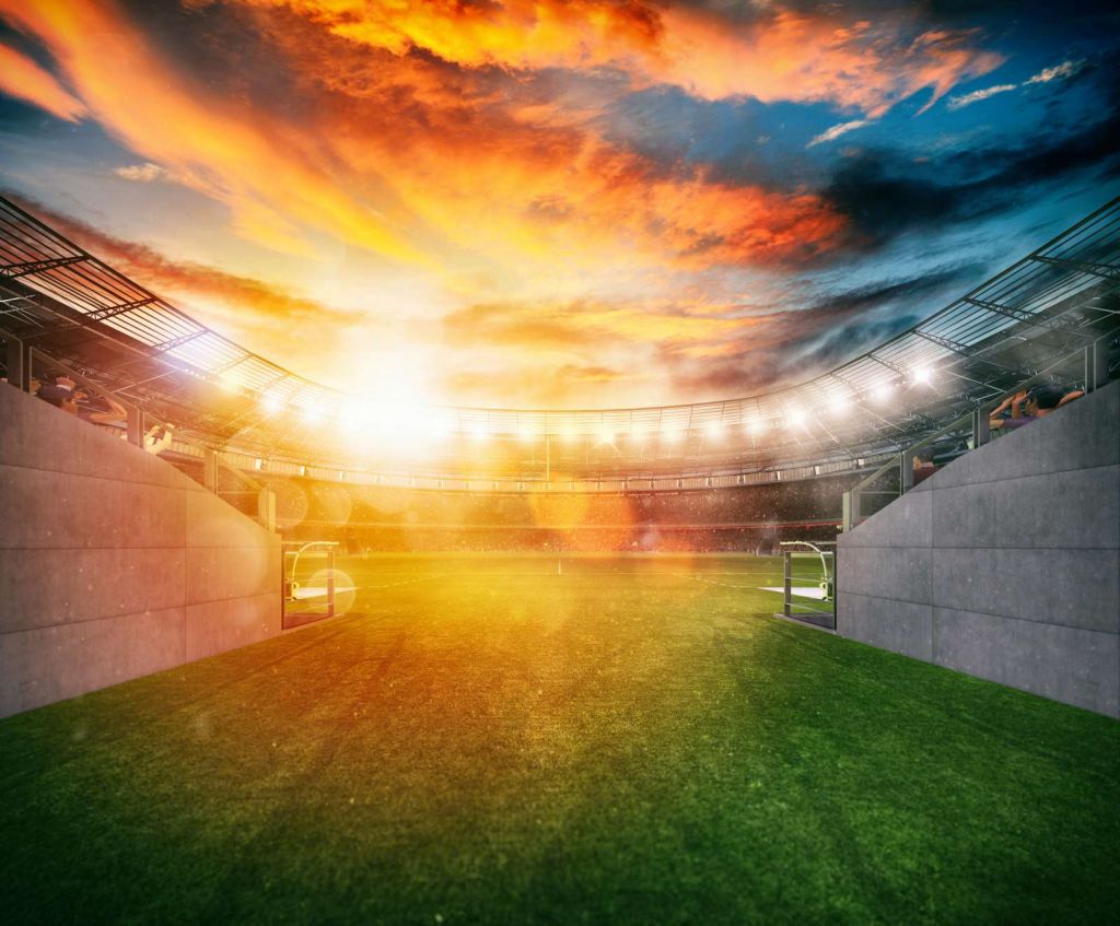 Voetbalstadion ingang bij zonsondergang